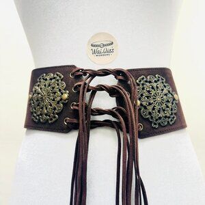 Brown faux suede lace up corset belt with metal floral design and fringe